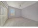 Bedroom featuring plush carpeting, a ceiling fan, and light purple walls at 6221 S 45Th Gln, Laveen, AZ 85339