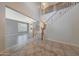 View of the tiled foyer with a view to the staircase and other rooms at 6221 S 45Th Gln, Laveen, AZ 85339