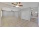 Large living space with neutral tile, an open layout, and stairs to the upper level at 6221 S 45Th Gln, Laveen, AZ 85339