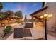 Outdoor kitchen area with grill and tiled countertop near covered patio and cabana, perfect for outdoor entertaining at 6221 S 45Th Gln, Laveen, AZ 85339