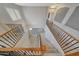 View of the two story entry staircase with wood and wrought iron railing at 6221 S 45Th Gln, Laveen, AZ 85339