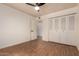 Bedroom with wood floors and a closet at 6837 E Osborn Rd # F, Scottsdale, AZ 85251