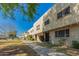 Inviting townhome complex boasting well-manicured lawns, mature trees, and a serene residential atmosphere at 6837 E Osborn Rd # F, Scottsdale, AZ 85251