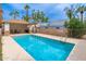 Community pool with crystal clear water, a covered seating area, and mature landscaping at 6920 E 4Th St # 209, Scottsdale, AZ 85251