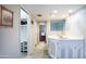 Bathroom area featuring a vanity area, tile floor, and walk-in closet at 7125 N 2Nd Pl, Phoenix, AZ 85020