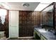 Bathroom with ornate wallpaper, marble counters and vanity at 7125 N 2Nd Pl, Phoenix, AZ 85020