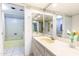 Well-lit bathroom featuring a double vanity, large mirrors, and a bathtub at 7125 N 2Nd Pl, Phoenix, AZ 85020