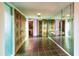 Unique foyer design featuring vintage carved doors and a mirrored accent wall at 7125 N 2Nd Pl, Phoenix, AZ 85020