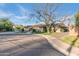 A street view shows the home's front yard, landscaping, and brick facade under a clear blue sky at 7125 N 2Nd Pl, Phoenix, AZ 85020