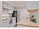 Well-lit kitchen featuring white cabinets, butcher block countertops, and modern appliances at 8130 N 32Nd Dr, Phoenix, AZ 85051