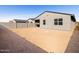 The backyard is enclosed by a block wall, providing a private space with endless possibilities for custom design at 8613 W Warner St, Tolleson, AZ 85353