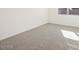 Clean and cozy bedroom with neutral carpet and plenty of natural light at 8613 W Warner St, Tolleson, AZ 85353