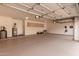 Spacious garage with painted floor and ample storage at 9393 E Hunter Ct, Scottsdale, AZ 85262