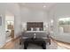 Well-lit main bedroom featuring a padded headboard and stylish decor with plenty of natural light at 9393 E Hunter Ct, Scottsdale, AZ 85262