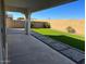 View of the backyard featuring grass and pavers at 9804 E Red Giant Dr, Mesa, AZ 85212