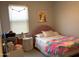 Charming bedroom featuring a colorful blanket and whimsical decor at 9804 E Red Giant Dr, Mesa, AZ 85212