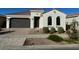 Charming single-story home with a well-maintained front yard and a two car garage at 9804 E Red Giant Dr, Mesa, AZ 85212