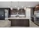 Kitchen island with stainless appliances and granite countertops at 9932 E Tumbleweed Ave, Mesa, AZ 85212