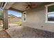 Covered patio boasts brick pavers and a ceiling fan for outdoor enjoyment at 9932 E Tumbleweed Ave, Mesa, AZ 85212