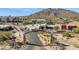 Aerial view of Carefree sign leading to downtown shops and businesses with mountain backdrop at 1 Easy St # 11, Carefree, AZ 85377