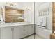 Bright bathroom featuring a double vanity with quartz countertop and modern fixtures at 1 Easy St # 11, Carefree, AZ 85377