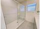 Modern tiled shower features a glass enclosure and seating at 1 Easy St # 11, Carefree, AZ 85377