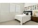 Bright bedroom featuring a large window, plush bedding, and stylish decor at 1 Easy St # 11, Carefree, AZ 85377