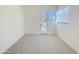 Bright bedroom featuring neutral carpet and a door to the outside at 1 Easy St # 11, Carefree, AZ 85377