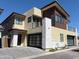 Modern two-story home with a brick driveway and dual garage doors at 1 Easy St # 11, Carefree, AZ 85377