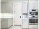 Bright kitchen features stainless steel Bosch appliances and stone countertops at 1 Easy St # 11, Carefree, AZ 85377
