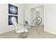 Bright office space with a glass desk, modern art, and white chair at 1 Easy St # 11, Carefree, AZ 85377