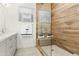 Modern shower with glass enclosure and a wood-look tiled wall and built-in bench at 1 Easy St # 11, Carefree, AZ 85377