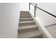 Carpeted staircase with modern metal railing at 1 Easy St # 11, Carefree, AZ 85377