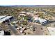 An aerial view of a quaint desert town featuring a mix of commercial and residential buildings at 1 Easy St # 3, Carefree, AZ 85377