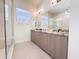 Modern bathroom featuring double sinks with granite countertop, and a glass walk-in shower at 1 Easy St # 3, Carefree, AZ 85377