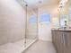 Bright bathroom featuring an open glass shower and modern vanity with granite countertop at 1 Easy St # 3, Carefree, AZ 85377