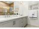 Elegant bathroom with gray cabinetry, quartz countertop, and modern hardware at 1 Easy St # 3, Carefree, AZ 85377