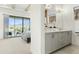 Bright primary bathroom showing dual sinks, modern vanity, and bedroom in background at 1 Easy St # 3, Carefree, AZ 85377