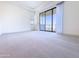 Large carpeted room with ample natural light, recessed lighting, balcony access and views to the outside at 1 Easy St # 3, Carefree, AZ 85377