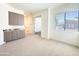 Carpeted room with built-in cabinet, granite counter and window offering natural light, plus an adjacent room at 1 Easy St # 3, Carefree, AZ 85377