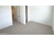 Bedroom featuring neutral walls, carpet, an open closet, and natural light at 1 Easy St # 3, Carefree, AZ 85377