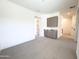 Spacious, carpeted bedroom with modern built-in cabinetry, granite counters, and access to other rooms at 1 Easy St # 3, Carefree, AZ 85377
