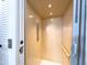 Interior of a residential elevator featuring light wood paneling, recessed lighting, and accessible controls at 1 Easy St # 3, Carefree, AZ 85377