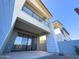Upward view showcasing a modern townhouse exterior with a private patio, glass balcony, and contemporary design at 1 Easy St # 3, Carefree, AZ 85377
