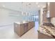 Kitchen with an island, stainless steel dishwasher, gas range, and granite countertops at 1 Easy St # 3, Carefree, AZ 85377