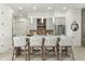 Elegant kitchen island with seating, pendant lights, and stainless steel appliances at 1 Easy St # 3, Carefree, AZ 85377