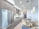 Spacious kitchen with stainless steel appliances, granite countertops, a central island, and wooden cabinets at 1 Easy St # 3, Carefree, AZ 85377