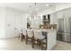 Well-lit kitchen with island, stainless steel refrigerator, and modern pendant lighting at 1 Easy St # 3, Carefree, AZ 85377