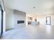 Open-concept living room with a modern fireplace and seamless access to the kitchen at 1 Easy St # 3, Carefree, AZ 85377