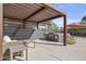 Outdoor lounge area with a BBQ grill and comfortable seating beneath a pergola at 1 Easy St # 3, Carefree, AZ 85377